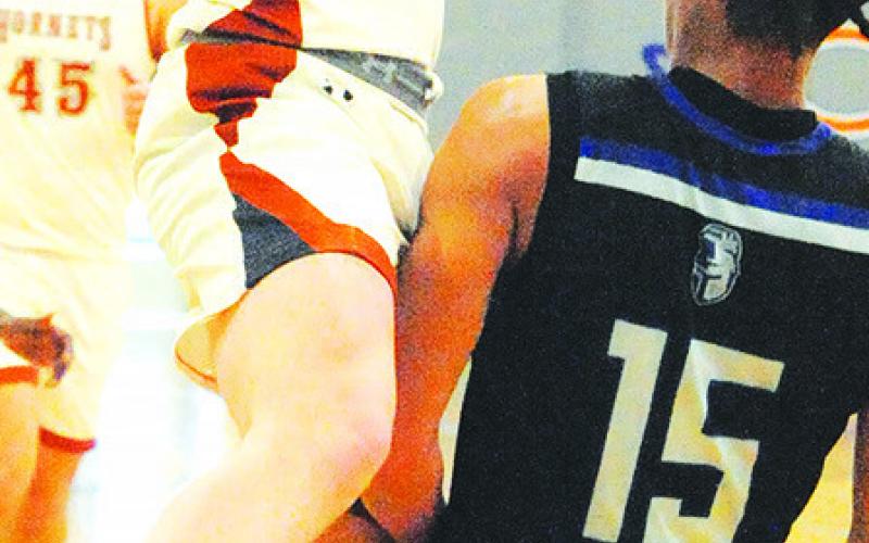 CALDWELL’S NATHAN Scott hurls this pass against Manor New Tech on Saturday.