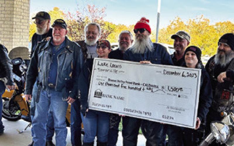 THE SOMERVILLE LAKE LOONS BIKE CLUB makes a donation at the 2023 Food for Families food drive. Photo courtesy of Janice Easter