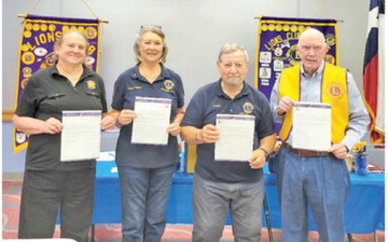 LIONS CLUB INTERNATIONAL recognized four local Lions with Chevrons for continuous service to Lionism. Pictured, from left, are Lions Bemie Polansky, 15 years; Linda O’Brien, 20 years; Adrien Drouilhet, 40 years; and Bob Towslee, 55 years. Photo courtesy of Adrien Drouilhet