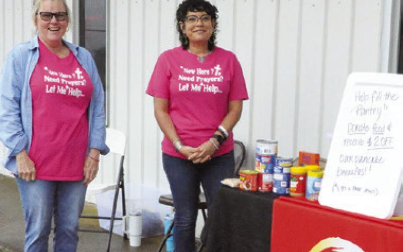 ONE CHURCH WAS collecting canned goods as an optional fee to eat breakfast with Santa and Mrs. Claus at Saturday’s “Breakfast with the Claus’ ” held at the VFW Post in Caldwell. Tribune photo by Denise Squier