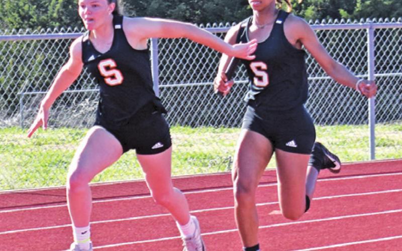 THE SOMERVILLE GIRLS’ 4x100-meter relay team won gold at last week’s Happy Skrabanek Relays. Pictured are, from left, Emma Kovasovic and Ra’Maya Carter. --Tribune photo by Roy Sanders