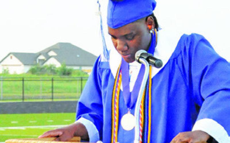 SNOOK SALUTATORIAN Mykia Munson addresses her classmates during Friday night’s high school graduation at Bluejay Stadium.