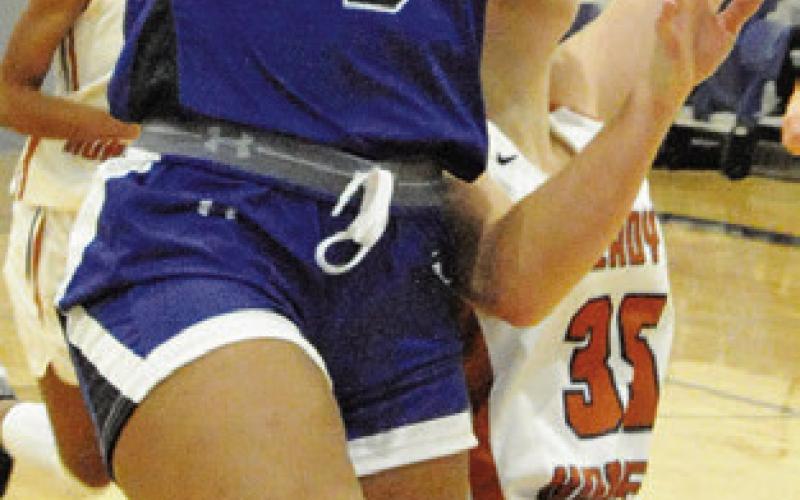 ALANA STRINGFELLOW shoot a layup during the Snook-Caldwell game on Saturday.