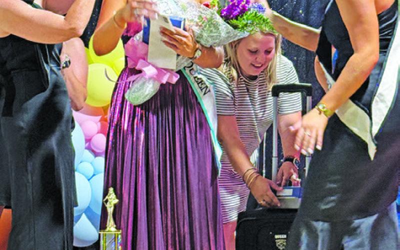 THE 2025 BURLESON COUNTY FAIR Queen Kodi Hitchcock is having her crown pinned by Rebekah Hruska after Sunday’s Fair Queen Contest. Also pictured are Carlee Flores and Hadleigh Novosad. Tribune photo by Denise Squier