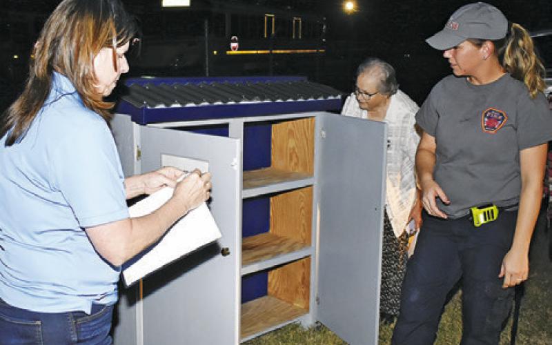 THE FOOD PANTRY is unloaded at the Snook Fire Station. Pictured are, from left, Cindy Jarrott of Snook EEA, Beth Collins of Snook Volunteer Fire Department and Ann Sebesta of Snook EEA. See story inside.