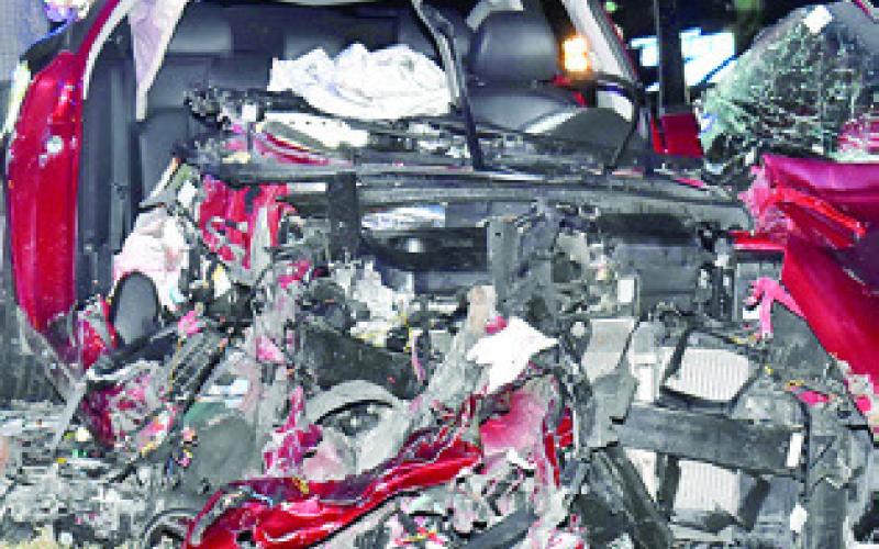 THIS KIA OPTIMA car was destroyed on Monday night in a head-on collision on State Highway 36, just north of Lyons. Tribune photo by Roy Sanders
