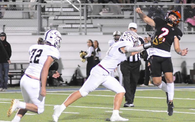 IAN TEAGUE OF Somerville hurls this pass last Friday against Junction in the regional quarterfinal playoff. Tribune photo by Denise Squier