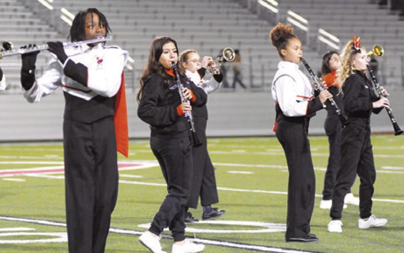 WOODWIND PLAYERS IN THE Somerville Yegua Band perform during the halftime of the Somerville-Junction regional football game last Friday night in Pflugerville. The band performed its contest show, “Time after Time.” Tribune photo by Denise Squier