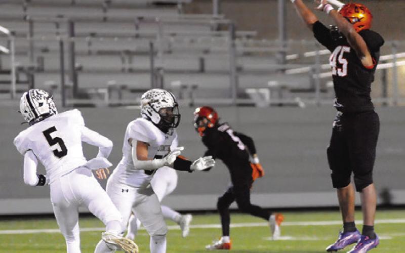 CHRIS DEERE OF Somerville defends against this Junction pass last Friday in the third round playoff game in Pflugerville. Tribune photo by Denise Squier
