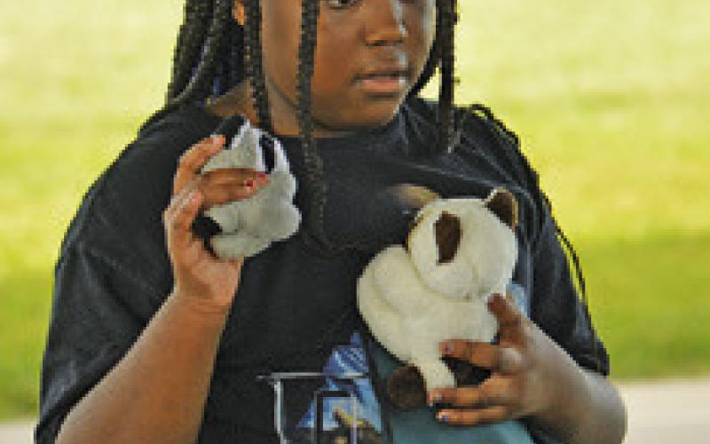 CHILDREN WERE able to select a stuffed animal at last Thursday’s Harrie P. Woodson Memorial Library’s “Hot on the Trail” event. TribunephotobyKimberlyHutcheson