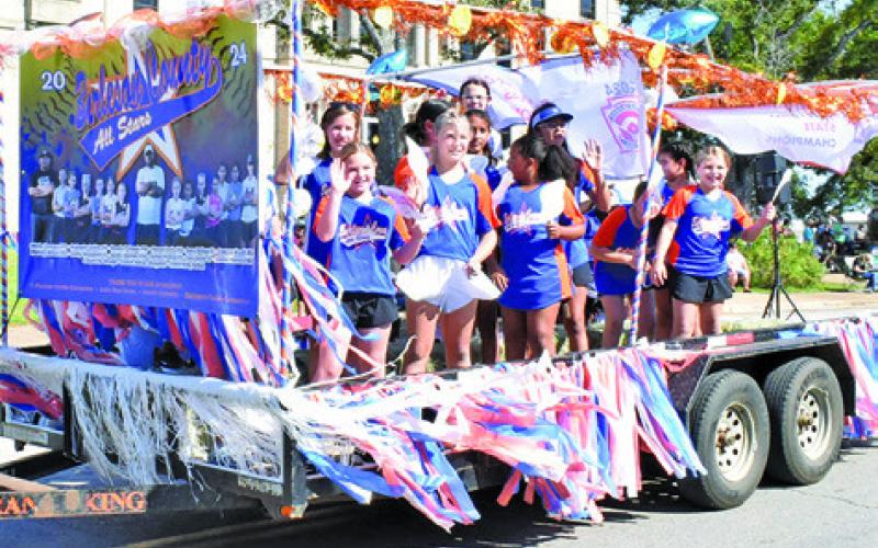 THIS FLOAT HONORED the Burleson County Minor Softball All-Stars during last Saturday’s Burleson County Fair Parade for winning the 8-10 year old softball Texas East State Tournament title in July. Tribune photo by Roy Sanders