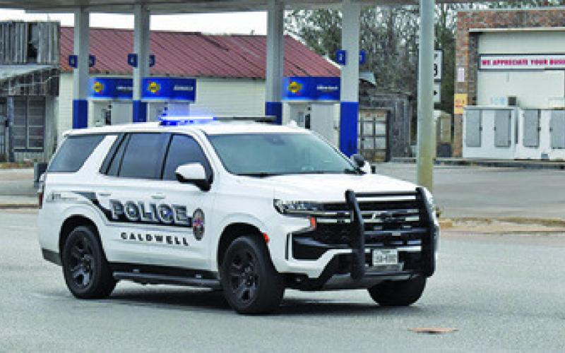 CALDWELL POLICE DIRECT traffic at the Main Street and State Highway 21 stop light on Monday during the power outage.
