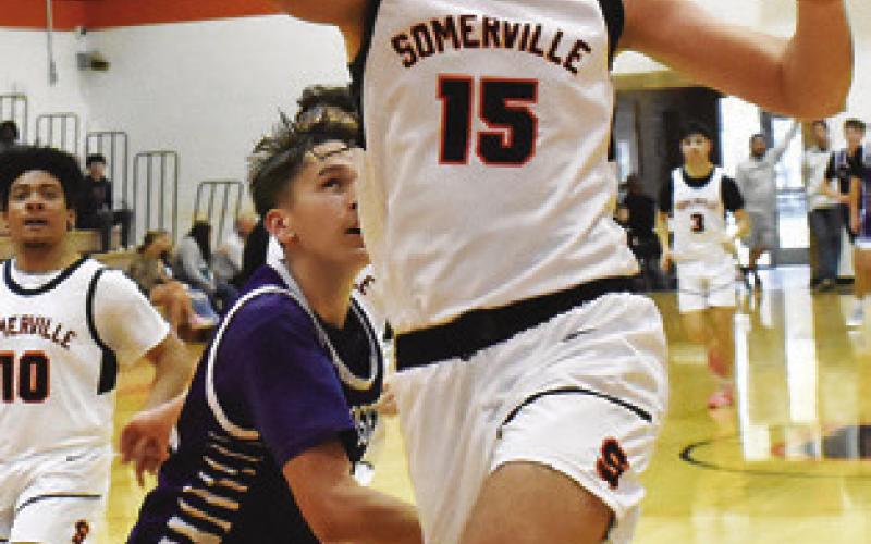 IRMAN SADIC OF Somerville moves in for a layup against St. Joseph. Tribune photo by Roy Sanders