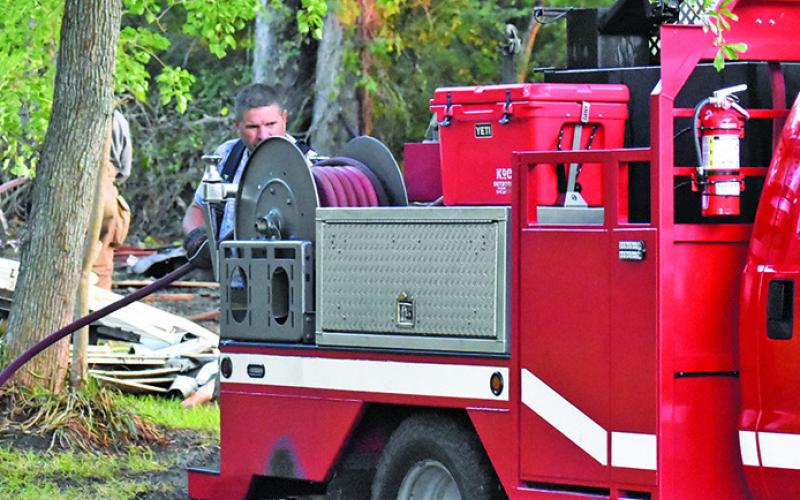 A FIREFIGHTER WORKS the scene of this fire on Friday, Aug. 15, on North Gray Street.