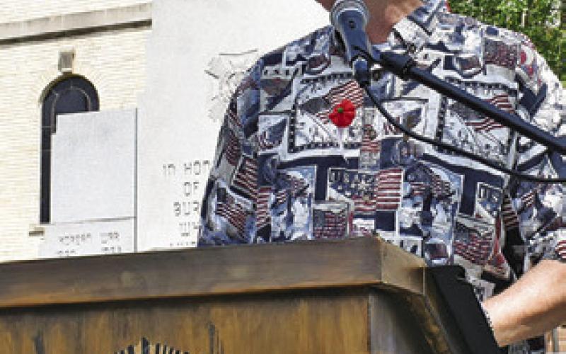 TONY ZACCAGNINO speaks at the Memorial Day service at the War Memorial.