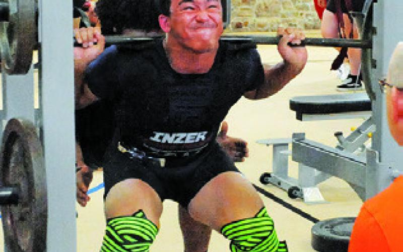 SOMERVILLE’S CHRIS DEERE lifts during Saturday’s Somerville Invitational Powerlifting Meet held in the Yegua Center. Tribune photo by Denise Squier