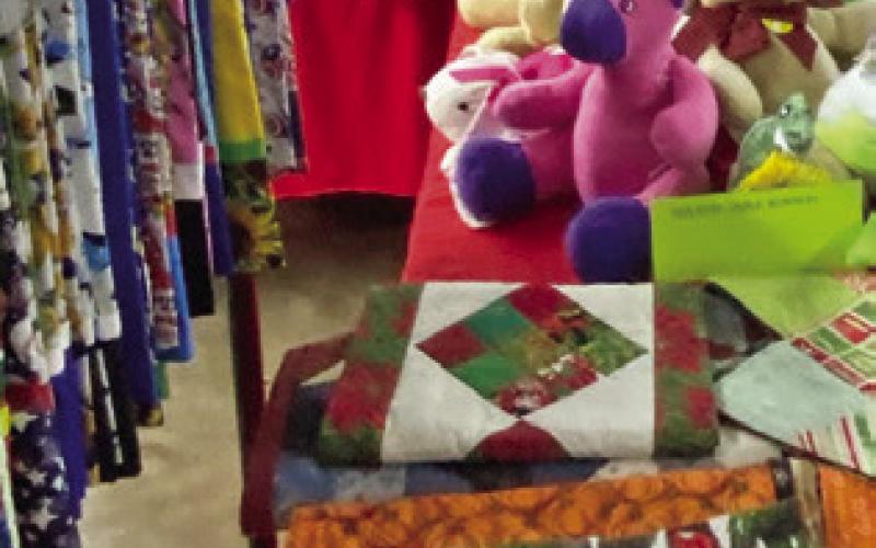 A SHOPPER looks at items at the Christmas Cottage event hosted by the Lyons Education Extension Association on Nov. 7 and 8. Items included were handmade arts, crafts and baked goods. Photo courtesy of Lyons EEA
