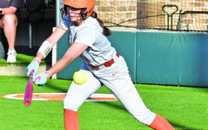BRYNN MORTON bats during the Caldwell-Giddings game last Friday at Weiss Field. Tribune photo by Roy Sanders