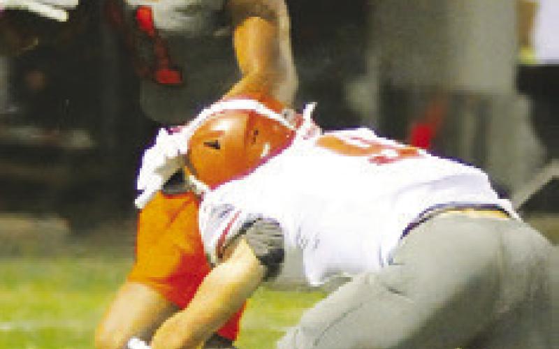 CALDWELL’S HAYS Beavers moves in for a tackle against Gonzales last Friday.