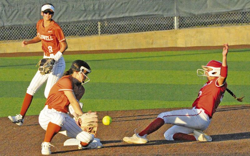 CALDWELL’S JAELYNN GEST attempts to catch the ball and make the tag during the Lady Hornet’s loss to Bellville on Tuesday. Tribune photo by Denise Squier