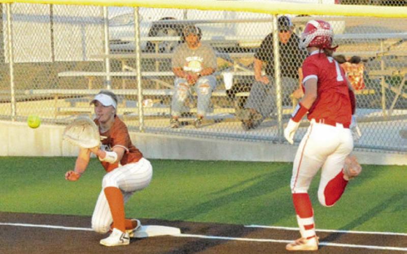 CALDWELL’S MIA WITHERWAX attempts to catch the throw for a force out at first during the Caldwell-Bellville game last week. Tribune photo by Denise Squier