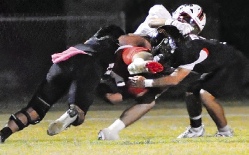 SOMERVILLE’S MARTIN ESPINOZA and Jayden Young make a tackle make a tackle against Burton in the homecoming game. Tribune photo by Denise Squier