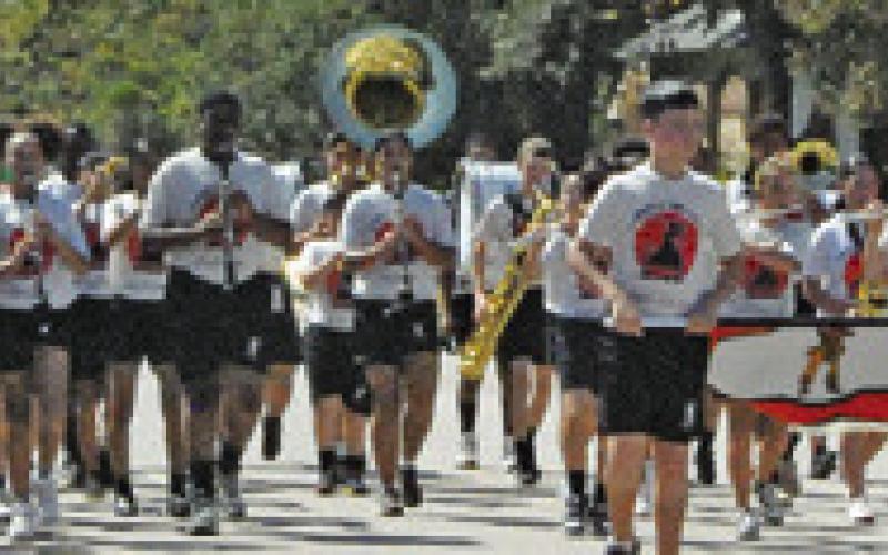 THEYEGUABANDgotthecrowdattendingSaturday’shomecomingparade up on their feet while playing the school’s fight song as the band marched. Tribune photo by Denise Squier