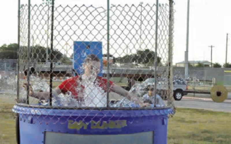 KAELY BROWN was put into the dunk tank at the “Caldwell Homecoming Kickoff” event. Tribune photo by Denise Squier