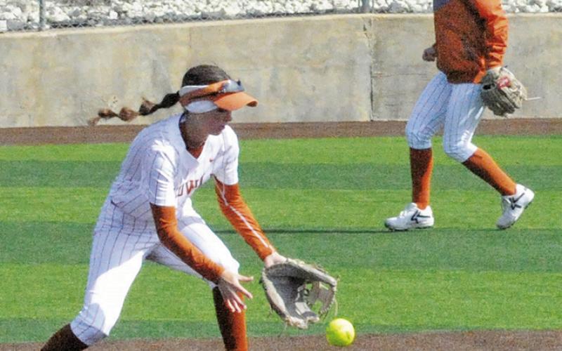 CALDWELL’S JILLIAN VYKUKAL attempts to field the ball during the Caldwell-Glenn tournament game last Thursday at Weiss Field. Tribune photo by Denise Squier