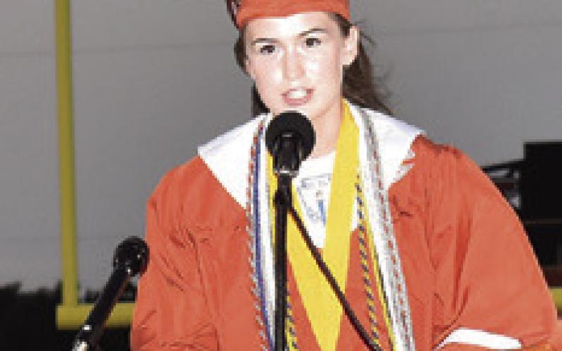 MARY HANCOCK delivers her Valedictorian Address at the Friday commencement.