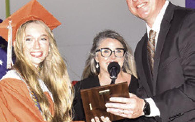 DR. JAMES BARTON, Caldwell superintendent, recognizes Otylia Hicks as Caldwell High School’s Fourth Honor Graduate.