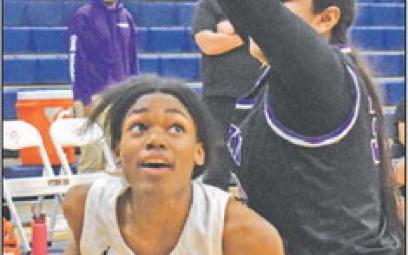 CALDWELL’S MYA Knoxson looks to shoot the ball during the Lady Hornet’s blowout win over Austin Achieve last Friday night.