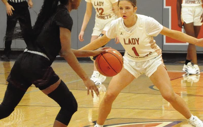 CALDWELL’S LYDIA HICKS defends during Caldwell’s 4431 win over Hearne last Tuesday night in Hornet Gym. Tribune photo by Denise Squier
