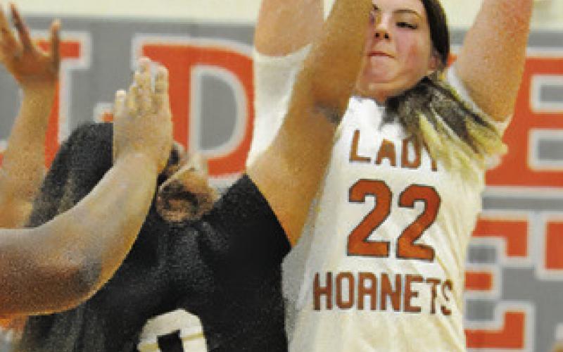 CALDWELL SOPHOMORE Kierstyn Macik takes a shot while being defended during Caldwell’s win over Hearne last Tuesday. Tribune photo by Denise Squier
