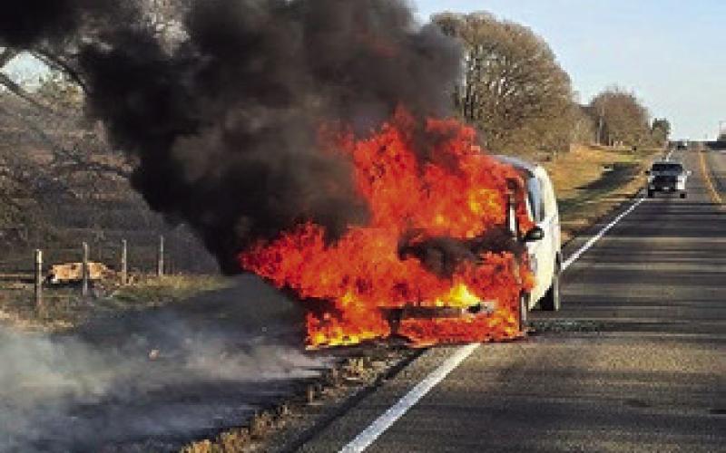 THIS POSTAL Service van burns on Dec. 31 off F.M. 3058. See story inside. Photo courtesy of Caldwell VFD