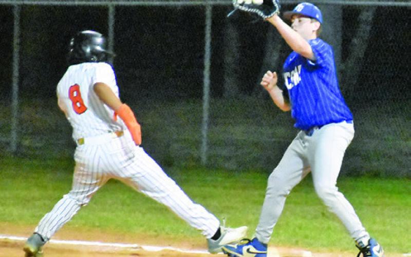 CHRISTIAN ESQUEDA GETS back to first base against Frassati Catholic School on Friday at the Somerville Classic Tournament. Tribune photo by Roy Sanders
