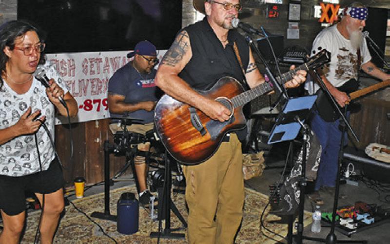 THE RED DIRT Ramblers Band performs on Saturday, June 21, at a benefit for Jody Hammons at Sidetrack’d Icehouse in Somerville. Pictured are, from left, Stacie Crocker, Juan Fraustro on drums, and Sy Nichols and Billy Gage on guitars.