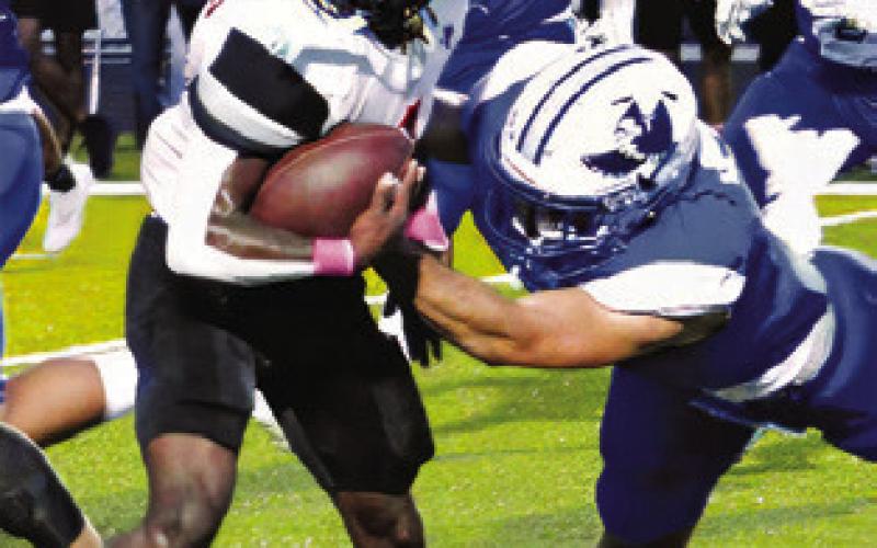 HERSCHEL CONWAY carries the ball against Snook. The Yeguas won 20-14 in overtime.