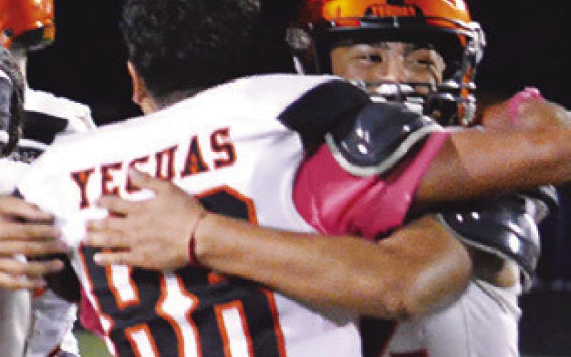 THE YEGUAS celebrate after a wild 20-14 overtime win over county rival Snook.