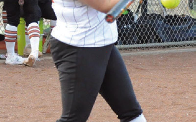 AUBREY KOVASOVIC hits a line drive to right field during the Snook-Somerville game on Tuesday. -- Tribune photo by Denise Squier