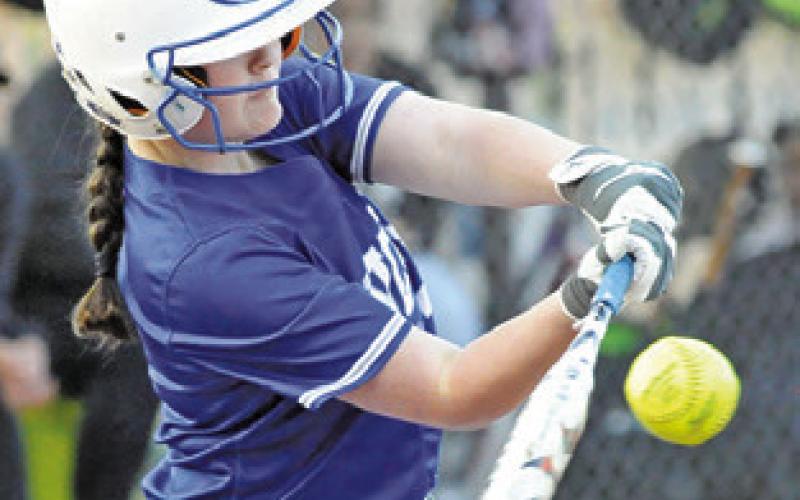 KAYLN COOPER hits the ball for a sacrifice fly during the Snook-Somerville game last Tuesday. -- Tribune photo by Denise Squier