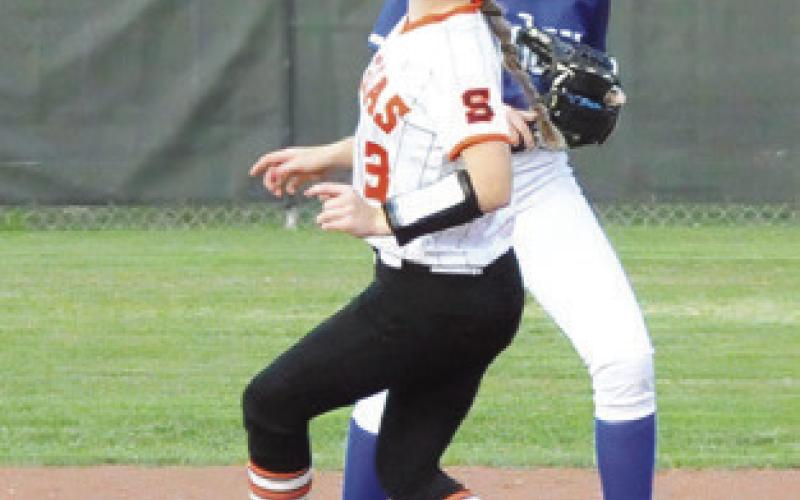 AUBREY FLENCHER makes it to second base during the Snook-Somerville game last Tuesday. Also pitctured is Snook’s Kaylie Holden.