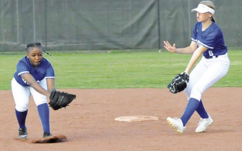SNOOK’S BRAYNIJA POOL lunges forward to catch the pop fly for a Somerville out during the Lady Jays’ win over the Lady Yeguas last week. Also pitctured is Kaylie Holden. -- Tribue photo by Denise Squier