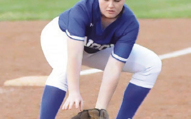KALYN COOPER FIELDS a ground ball during the Snook-Somerville game last week.