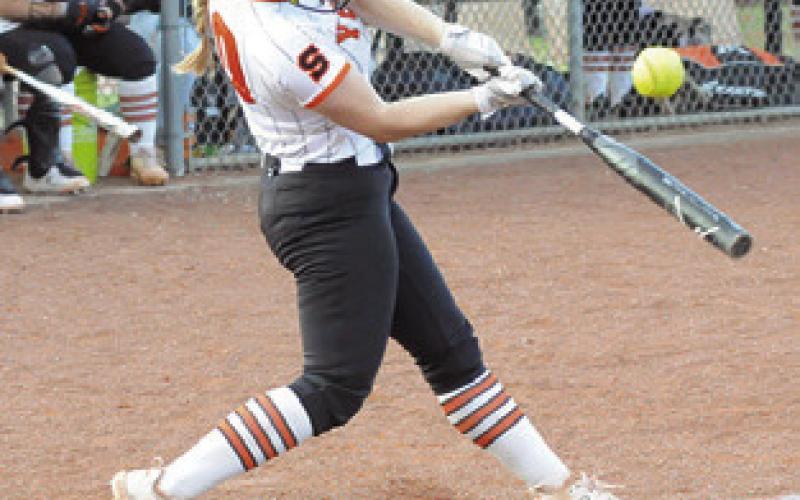 ABIGAIL FLENCHER hits a pop up to short during the Snook-Somerville game last week.