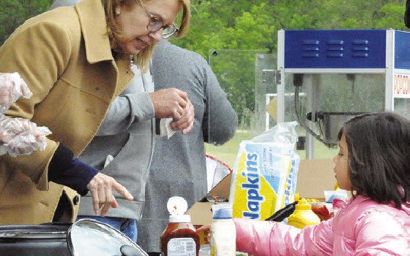 HOT DOGS AND HAMBURGERS were given out during the picnic portion of Saturday’s Easter-themed event hosted by First Baptist Church of Caldwell. Tribune photo by Denise Squier