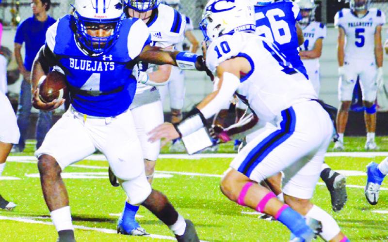 DOMINICK HANKINS CARRIES the ball last Friday against Falls City in Snook. Snook lost 28-0 and faces Yorktown this Friday in Yorktown.