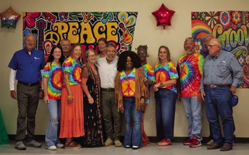 BURLESON HEALTH RESOURCE Center staff and supporters gather around Albert Ramirez to celebrate his retirement after 22 years of service. Tribune photo by Sabine Lazo