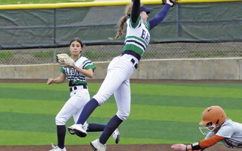 CALDWELL’S BREAN SIMS dives to slide into second base as a (Fort Worth) Eaton player is pulled off the bag by a throw during a tournament game at Lady Hornet Field. -- Tribune photo by Denise Squier