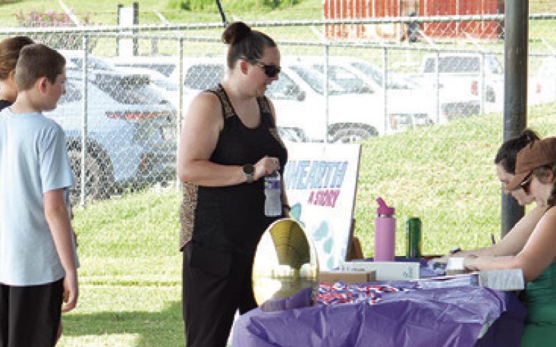 BOOTHS WITH FOOD AND GAMES were on hand at the Harrie P. Woodson Memorial Library’s end of summer water party. Tribune photo by Kimberly Hutcheson